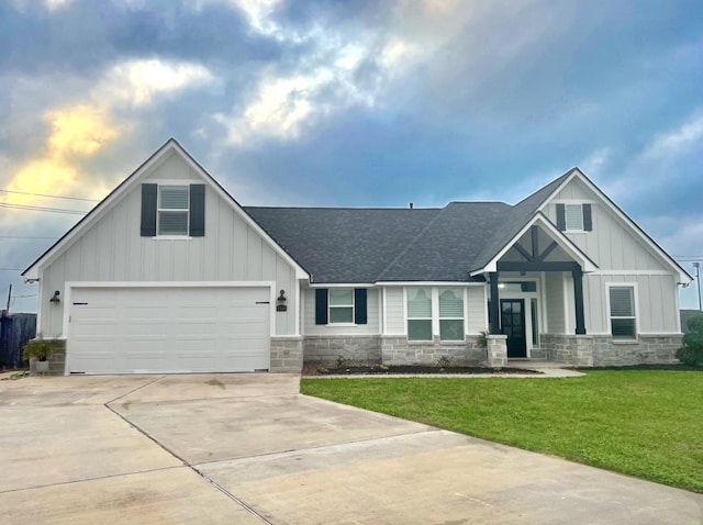 view of front of house with a garage and a front yard