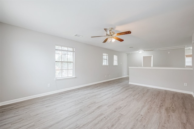 empty room featuring ceiling fan and light hardwood / wood-style floors