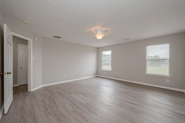 unfurnished room featuring ceiling fan and light wood-type flooring