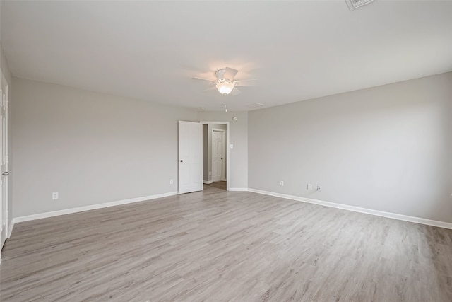 empty room featuring ceiling fan and light wood-type flooring