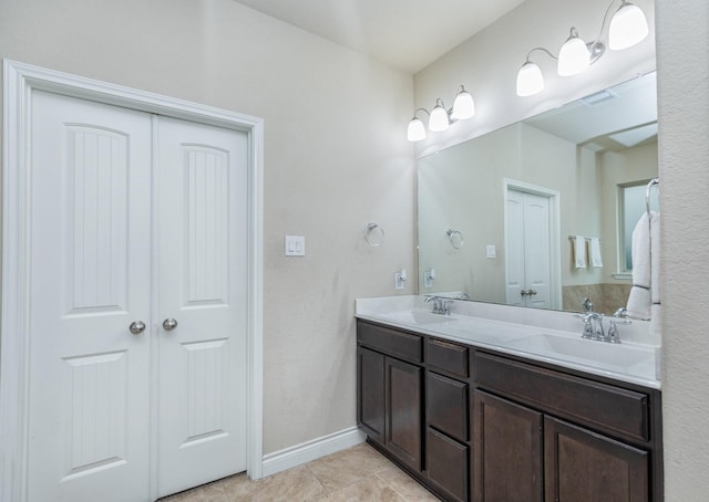 bathroom with tile patterned floors and vanity