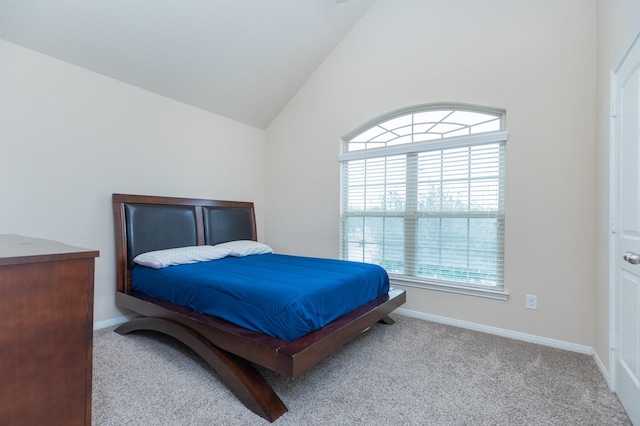 carpeted bedroom with vaulted ceiling