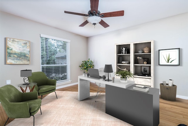 office area featuring light hardwood / wood-style flooring and ceiling fan