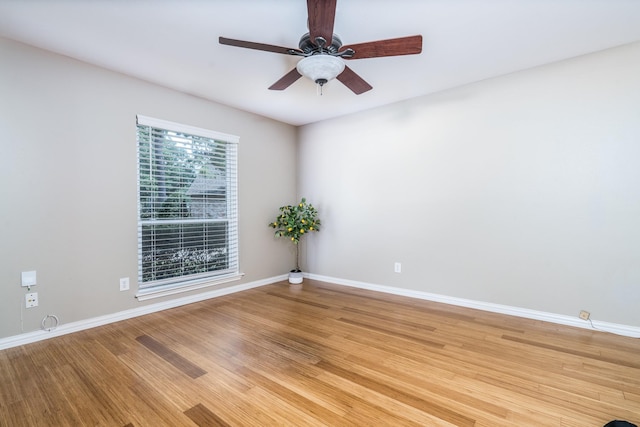 unfurnished room with hardwood / wood-style floors and ceiling fan