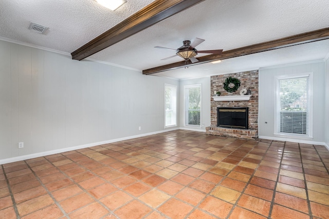 unfurnished living room with a wealth of natural light, a fireplace, a textured ceiling, and beamed ceiling