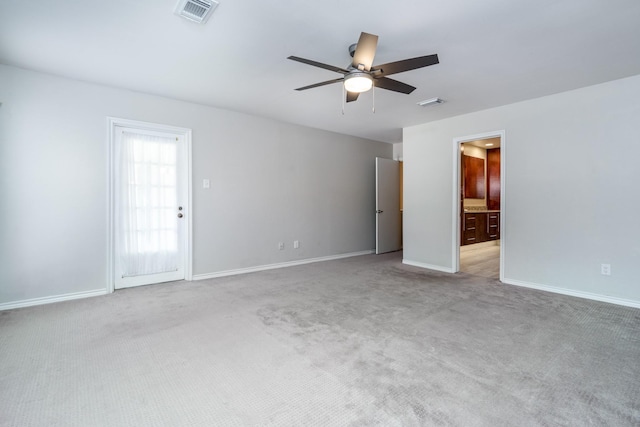 empty room with light carpet and ceiling fan