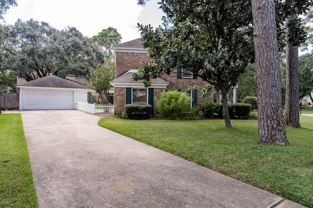 view of front of property with a garage and a front lawn