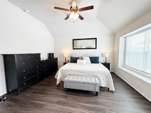 bedroom with vaulted ceiling, dark hardwood / wood-style floors, and ceiling fan