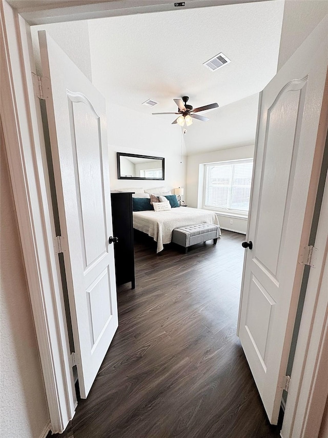 bedroom featuring dark wood-type flooring and ceiling fan