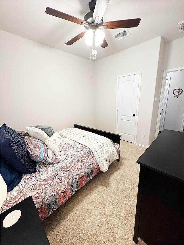 carpeted bedroom with ceiling fan