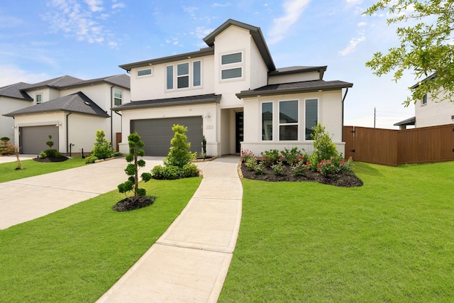 view of front of house with a garage and a front lawn