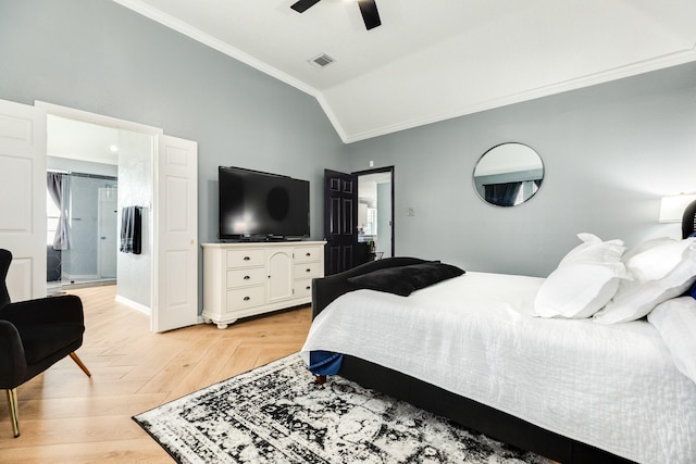 bedroom featuring ornamental molding, lofted ceiling, light parquet flooring, and ceiling fan