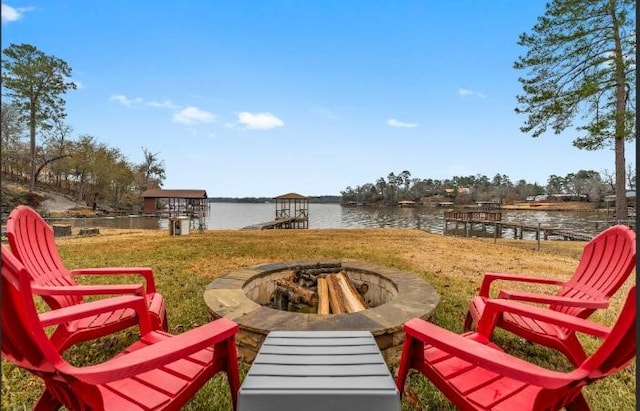 view of patio / terrace featuring a water view and an outdoor fire pit