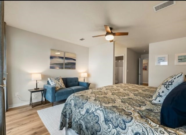 bedroom featuring light hardwood / wood-style floors and ceiling fan