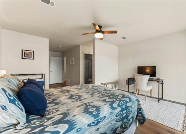 bedroom featuring hardwood / wood-style floors and ceiling fan