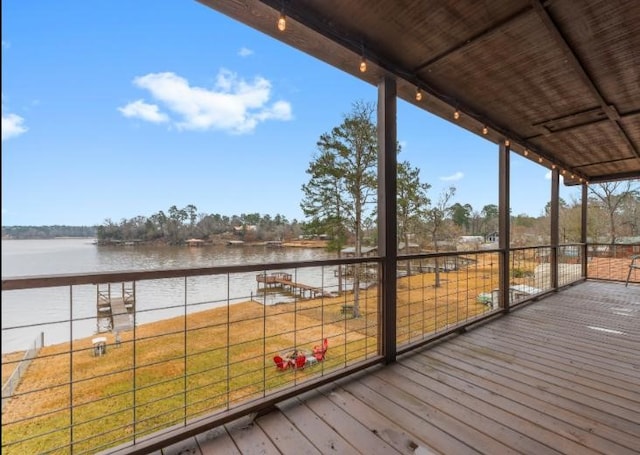 wooden deck featuring a water view