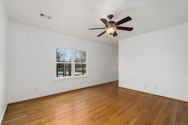 spare room with light hardwood / wood-style floors and ceiling fan