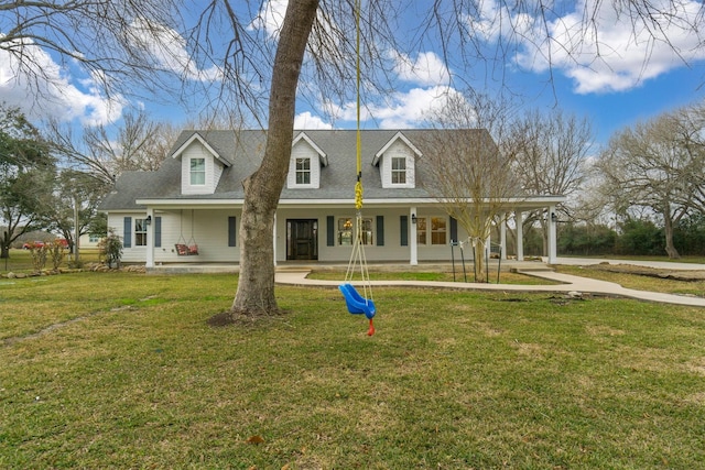 view of front of home featuring covered porch and a front lawn