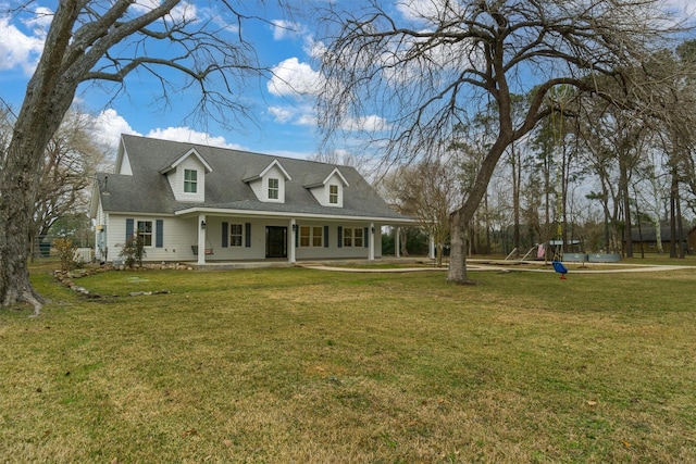 cape cod home featuring a front yard