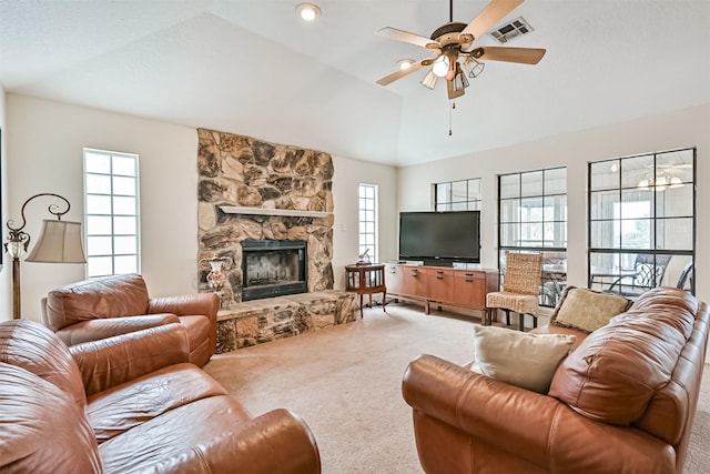 living room with ceiling fan, a fireplace, lofted ceiling, and carpet flooring