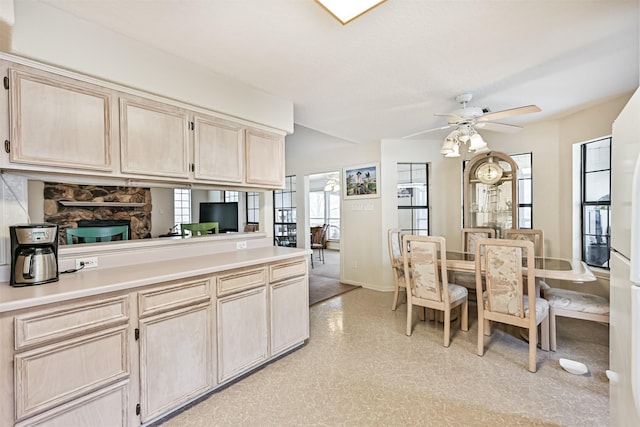 kitchen with light brown cabinets and ceiling fan