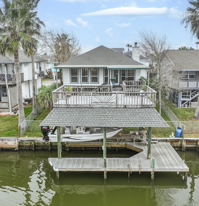 dock area featuring a deck with water view