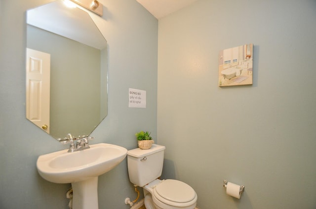 bathroom featuring toilet