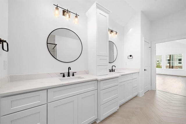 bathroom with parquet flooring and vanity