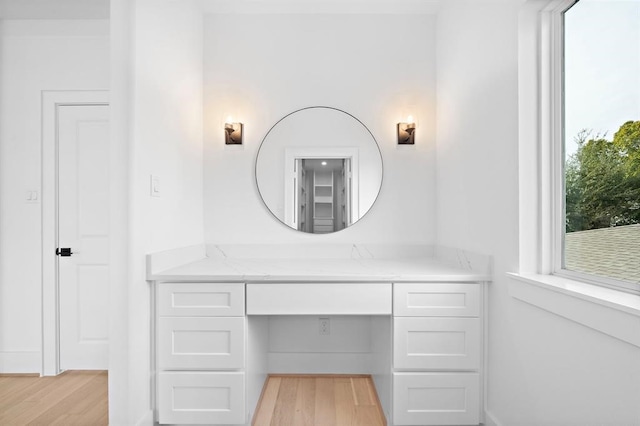 bathroom with vanity and hardwood / wood-style floors