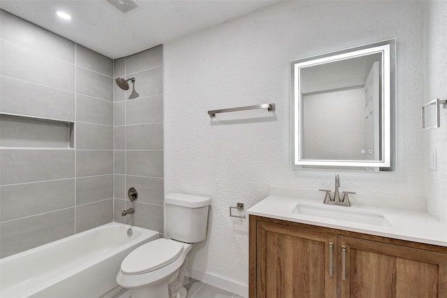 full bathroom featuring vanity, toilet, and tiled shower / bath