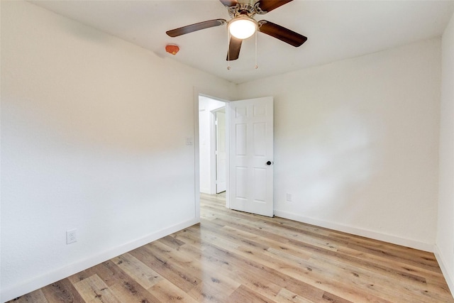 spare room with light hardwood / wood-style flooring