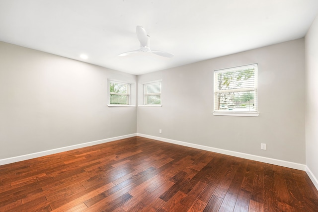 unfurnished room with ceiling fan, baseboards, and hardwood / wood-style floors