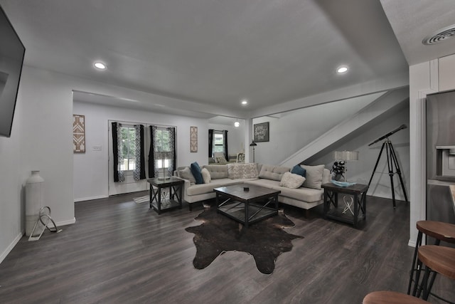 living room featuring dark wood-type flooring