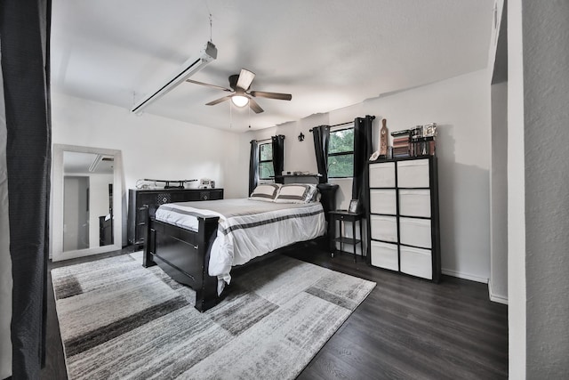 bedroom featuring ceiling fan and dark hardwood / wood-style flooring