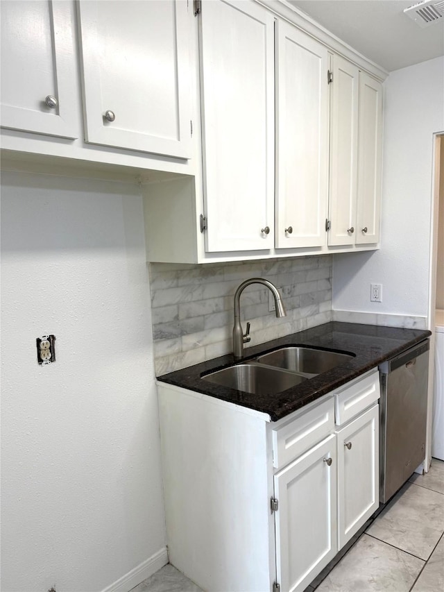 kitchen featuring dishwasher, sink, and white cabinets