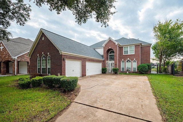 view of front property with a garage and a front lawn