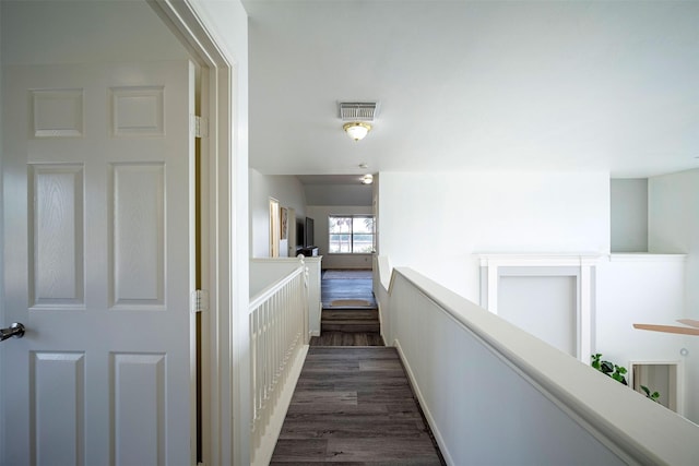 hallway featuring dark hardwood / wood-style flooring