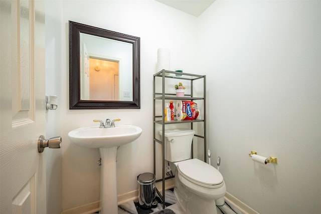 bathroom with sink and toilet