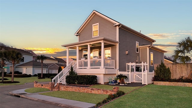 view of front facade featuring a yard and covered porch