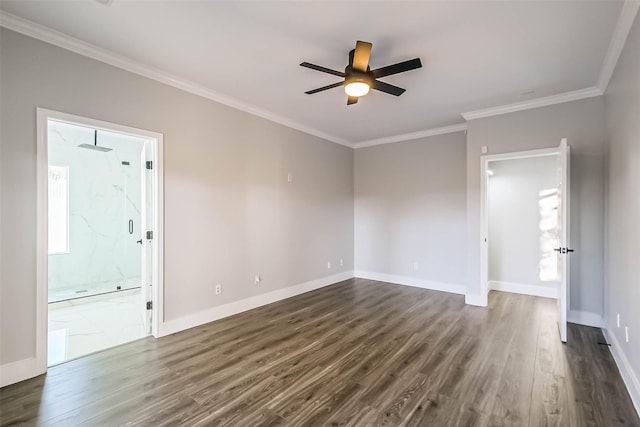 spare room with dark wood-type flooring, ornamental molding, and ceiling fan