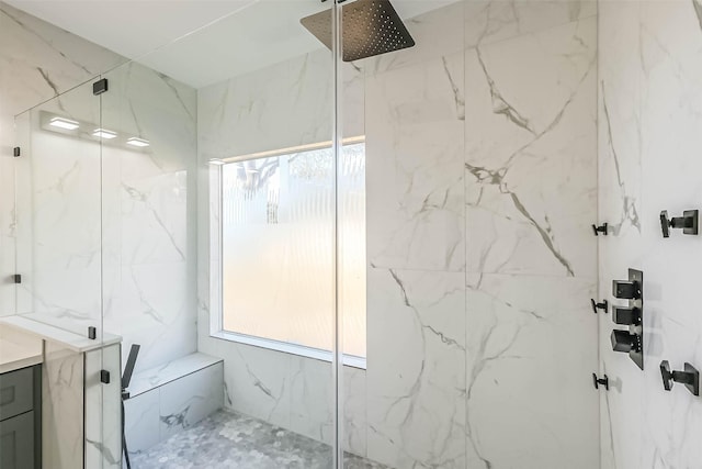 bathroom featuring vanity and an enclosed shower