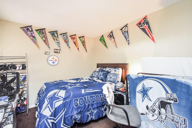 bedroom featuring dark carpet