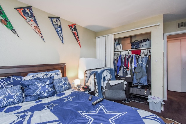 carpeted bedroom featuring a closet