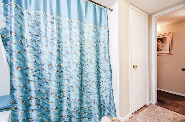 bathroom with a shower with curtain