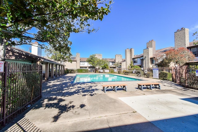 view of swimming pool featuring a patio