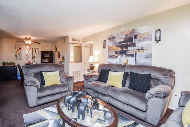 carpeted living room with ceiling fan