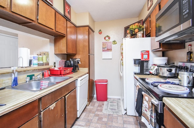 kitchen with sink and appliances with stainless steel finishes