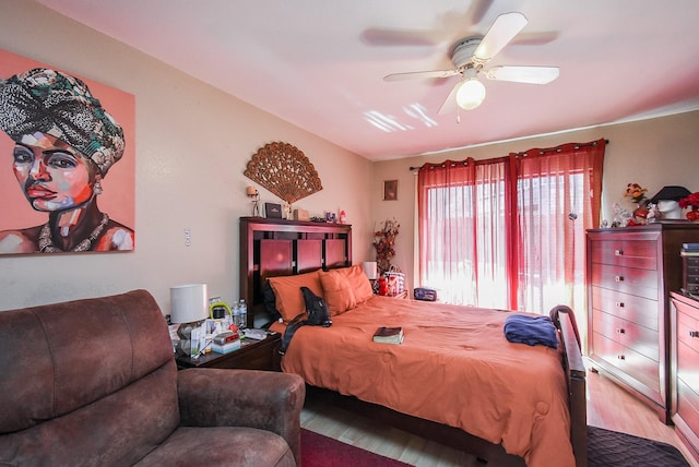 bedroom with ceiling fan and light hardwood / wood-style floors