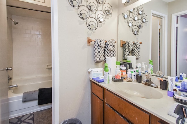 bathroom featuring  shower combination and vanity