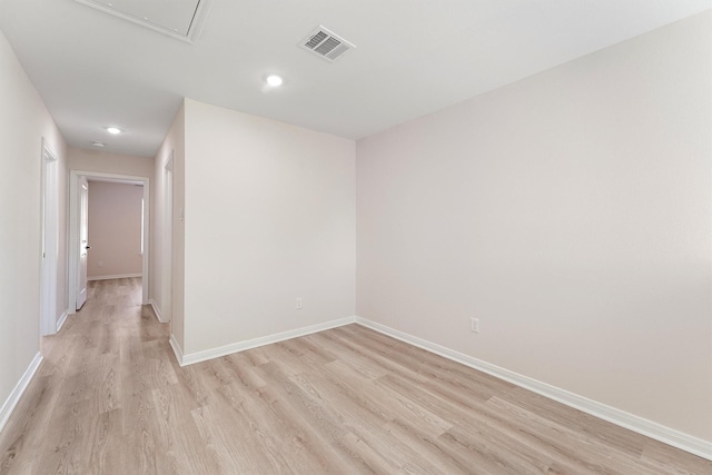 empty room with light hardwood / wood-style floors